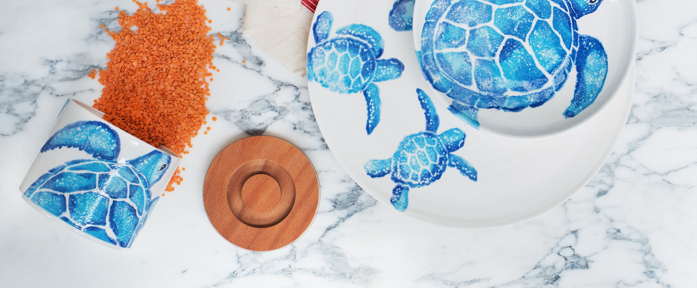 Creatures serveware and storage jar with blue turtle and wooden lid.