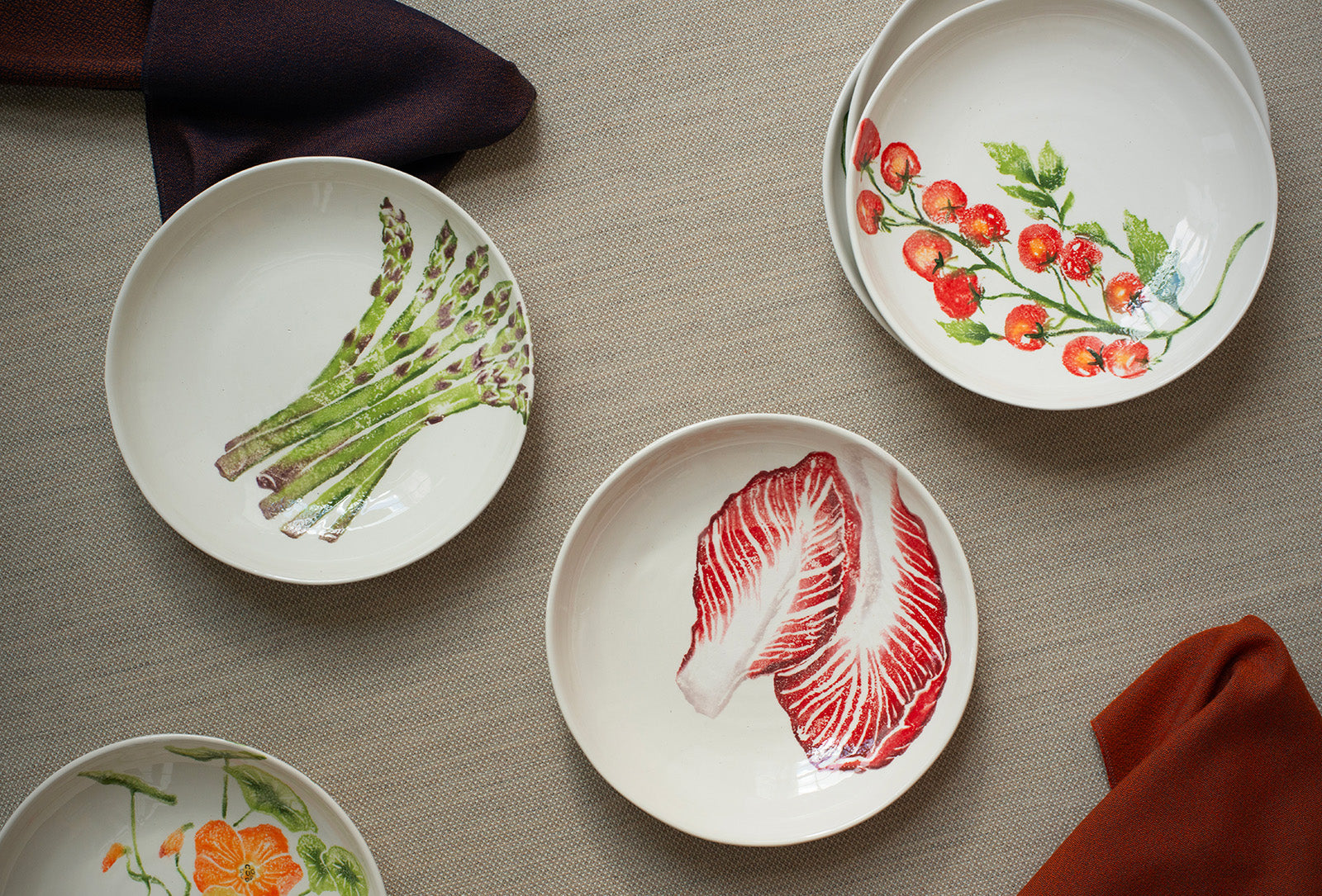 Insalata supper bowls featuring nasturtium, asparagus, radicchio and vine-ripened tomatoes.