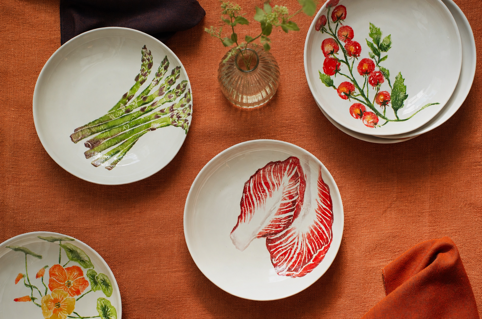 Insalata tableware including nasturtium, asparagus, radicchio and vine-ripened tomato supper bowls